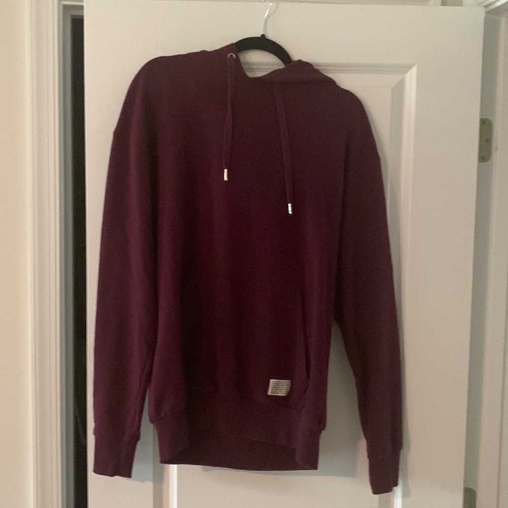 Burgundy, hooded sweatshirt by Divided. Size small.